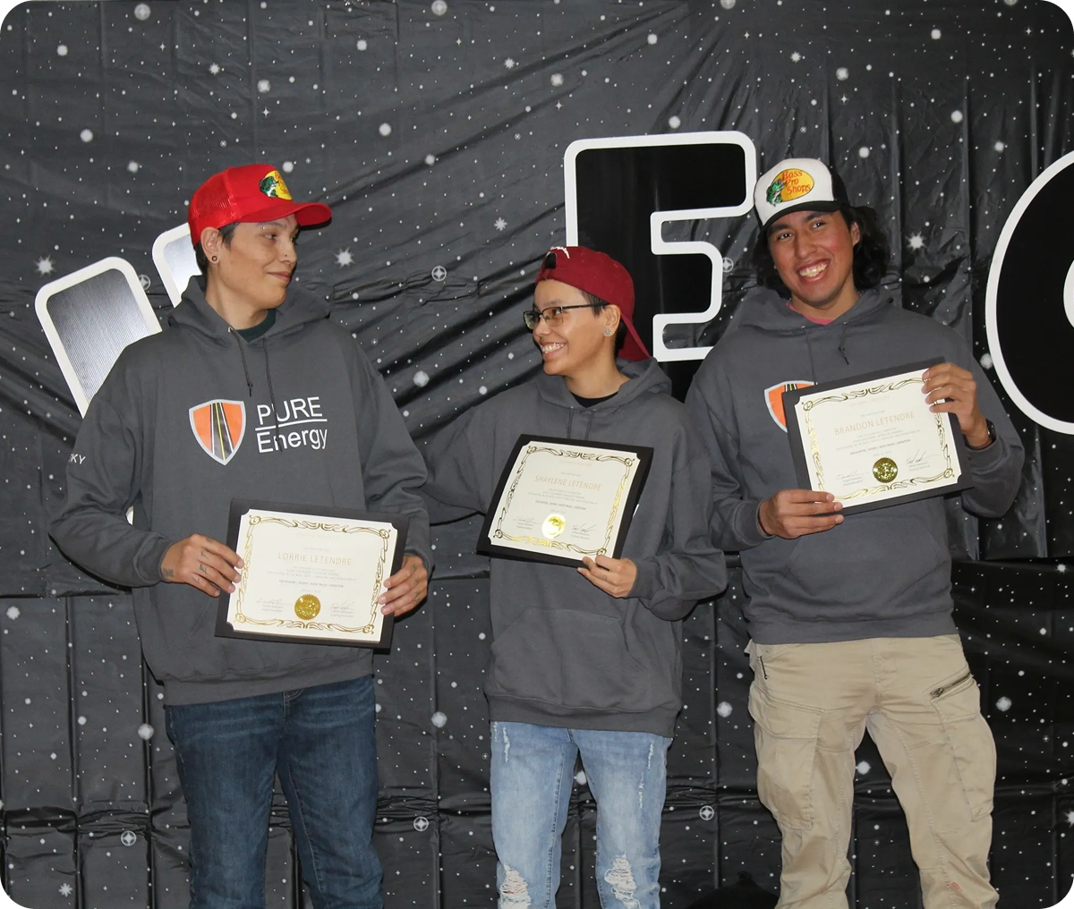 Friends in hoodies with awards