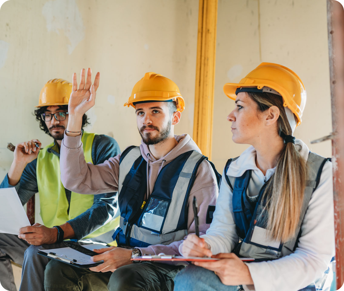 Workers taking notes on site
