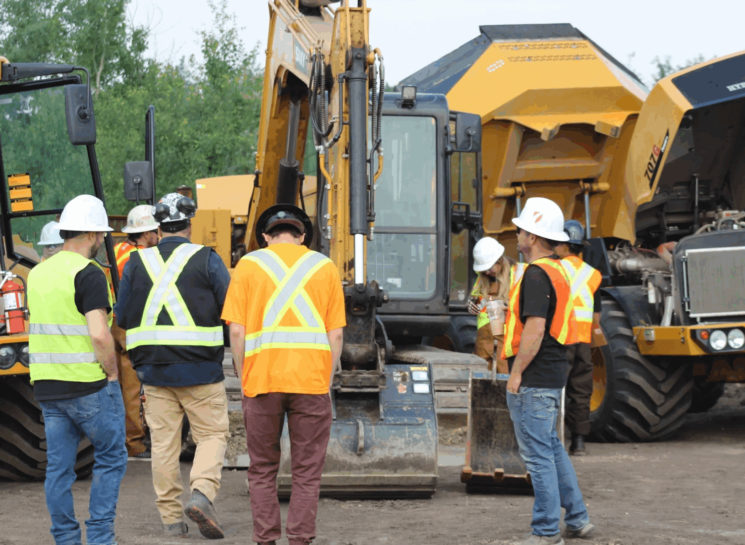 Workers in safety gear on job site