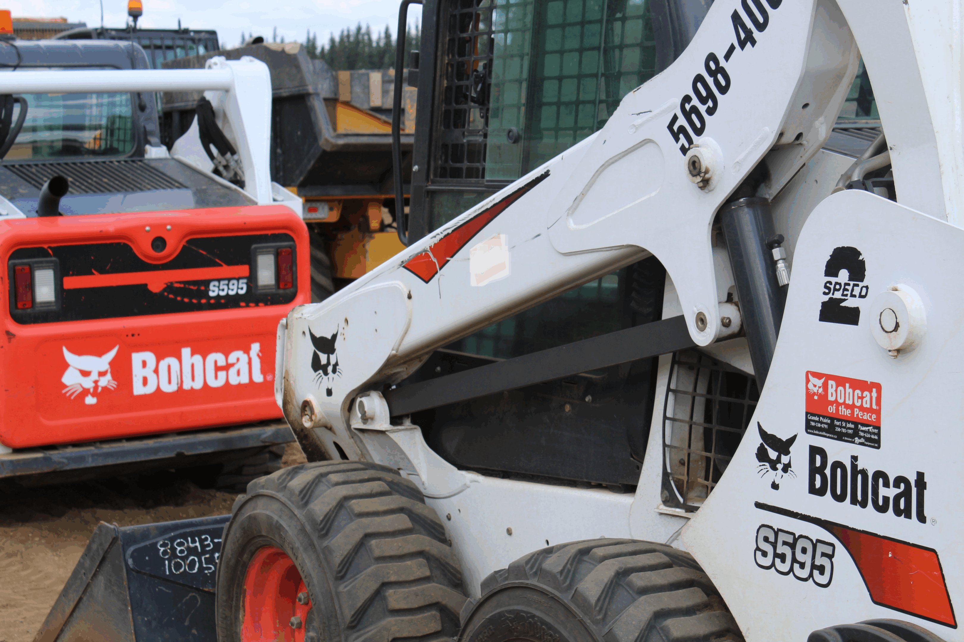 A Bobcat skid-steer loader at a construction site.