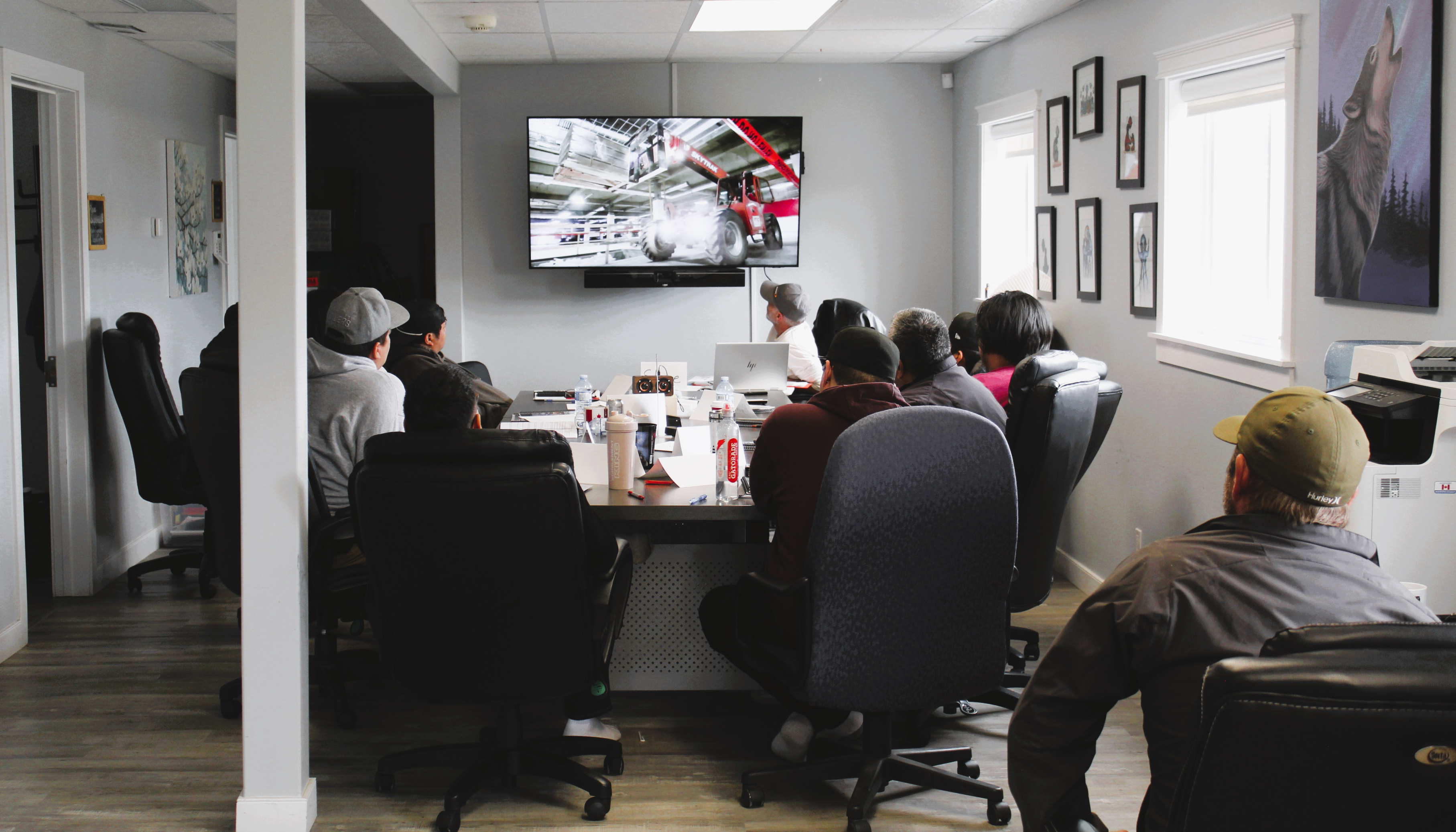 Team watching a presentation in a conference room.